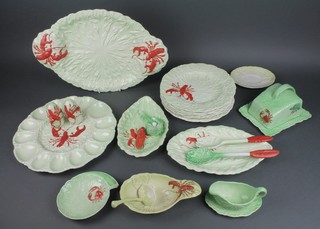 A quantity of Carltonware lobster decorated tableware comprising a large 2 handled platter, 6 dinner plates, a sauce boat and ladle, a salt and pepper, oval dish, butter dish and cover, 2 servers, a leaf shaped dish, a salad dish and 4 other items