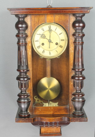 A striking Vienna style regulator with 6" paper dial contained in a walnut case 