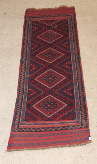 A red and blue ground Meshwani runner with 4 diamonds to the centre 102" x 24" 