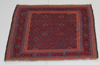 An Tribal Gazak blue and red ground square rug with diamonds to the centre 49" x 49" 
