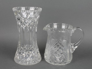 A cut glass waisted vase and a ditto jug 