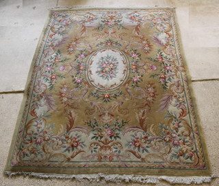 A Chinese yellow ground and floral patterned carpet 108" x 149" 