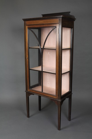 An Edwardian inlaid mahogany display cabinet with raised back, fitted shelves enclosed by an astragal glazed door, raised on square supports 57"h x 23"w x 13"d 