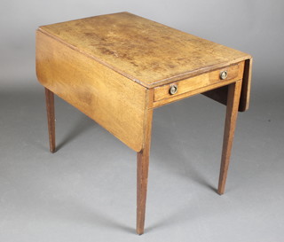 A Georgian mahogany Pembroke table fitted a drawer raised on square tapered supports 28"h x 34"w x 20 1/2" when closed x 40 1/2" when opened 