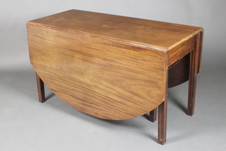A Georgian oval mahogany drop flap dining table raised on square supports 27"h x 48 1/2"w x 21" when closed x 69" when open 