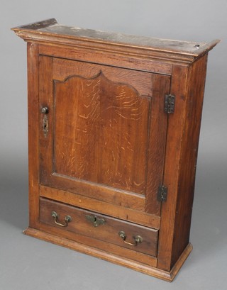 A 17th/18th Century oak hanging cabinet with moulded cornice, fitted shelves above 2 short and 1 long drawer, the base fitted 1 long drawer with iron lock and brass swan neck drop handles 34"h x 28"w x 11"d 