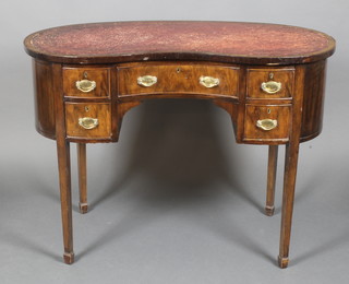 An Edwardian mahogany kidney shaped writing table with inset red leather writing surface above 1 long and 2 short drawers, raised on square tapering supports, spade feet 35"h x 42"w x 21"d 