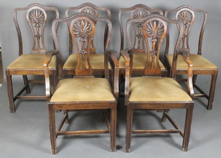 A set of 6 Hepplewhite style mahogany dining chairs with pierced vase shaped slat backs and upholstered seats, raised on square tapering supports united by a box stretcher 