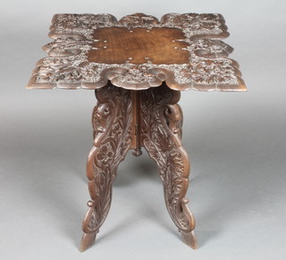 A square Burmese carved hardwood occasional table raised on a folding stand, carved fruit 24"h x 23"w x 24"d  