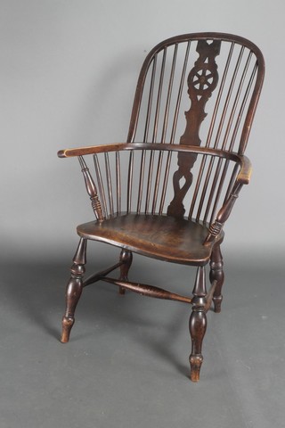A 19th Century elm stick and wheel back Windsor chair with H framed stretcher, raised on turned legs  