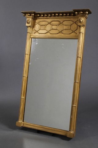 A Regency rectangular plate Pier mirror with ball studded frame, supported by a pair of reeded columns 38"h x 23 1/2"w