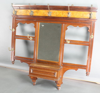 An Art Nouveau mahogany hanging coat rack with a bevelled plate mirror to the centre fitted hooks above a glove box 43"h x 42"w with later added top 