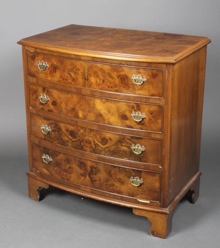 A Queen Anne style figured walnut bow front chest of 4 long drawers with brass plated drop handles, raised on bracket feet 32"h x 30"w x 19"d 