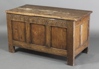 A 17th Century style oak coffer of panelled construction with hinged lid 21"h x 37 1/2"w x 18 1/2"d 