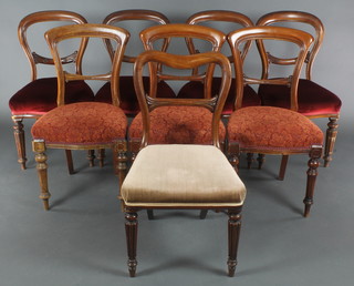 A harlequin set of 8 mahogany bar back dining chairs with carved mid rails and upholstered seats, made up of 5 and 3, raised on turned, fluted and reeded supports 