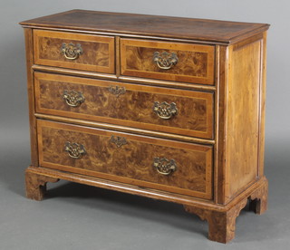 A Queen Anne style figured walnut chest with quarter veneer top and cross banding, fitted 2 short and 2 long drawers, raised on bracket feet 29 1/2"h x 36"w x 15"d 
