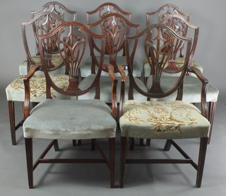 A part 18th Century set of 8 Hepplewhite style dining chairs, 4 being 18th Century (1 carver, 3 standard) and 4 having been made to match (1 carver, 3 standard) 
