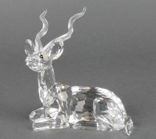 A Swarovski figure of a reclining deer 4", boxed 