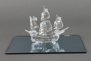 A Swarovski model of a galleon 4", on a mirrored base, boxed