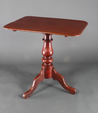A Victorian rectangular mahogany snap top wine table raised on a turned column and tripod base 28 1/2"h x 29"w x 22 1/2"d 