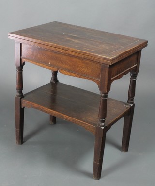 A 1930's Art Deco rectangular oak 2 tier bridge table 29"h x 26"w x 17" when closed by 35" when extended 