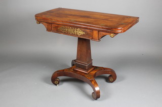A handsome Regency D shaped rosewood and brass inlaid card table, raised on square column and chamfered base with scroll feet 29"h x 36"w x 18"d  
