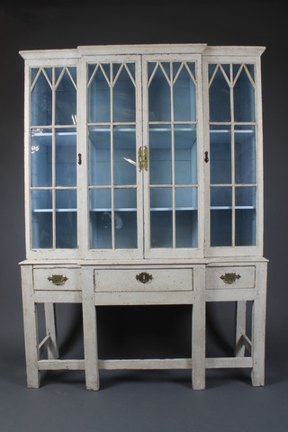 A Georgian style bow front painted cabinet on stand, the upper section with moulded cornice, fitted shelves enclosed by astragal glazed doors, the base fitted 1 long and 2 short drawers, raised on square tapering supports, box framed stretcher 67 1/2"h x 48"w x 17"d 