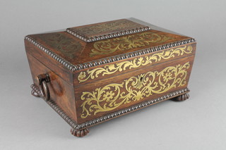 A William IV rosewood and brass inlaid trinket box of cushion form with hinged lid, with ring drop handles to the sides and raised on bun feet 5 1/2"h x 11 1/2"w x 8 1/2"d 