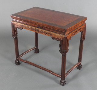 A rectangular Chinese Padouk occasional table with carved apron, raised on square supports 21"h x 24"w x 14"d 