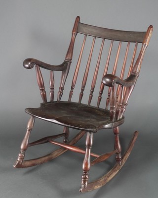 A 19th Century beech and pine stick back rocking Windsor style chair 