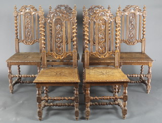 A set of 6 Victorian Carolean style carved oak high back chairs with pierced backs and solid seats 