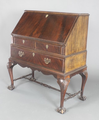 An Edwardian Chippendale style mahogany bureau, the fall front revealing a well fitted interior above 2 short and 1 long drawer, raised on cabriole supports, ball and claw feet 42"h x 33"w x 18"d 