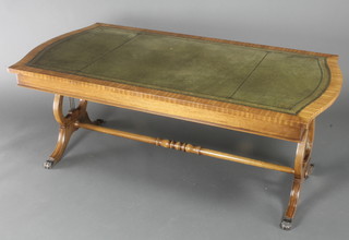 A Georgian style mahogany occasional table of rectangular shape with inset green leather surface, raised on lyre supports with H framed stretcher 21"h x 53"w x 27 1/2"d 