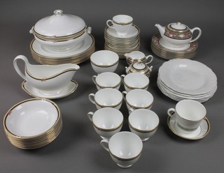 A Wedgwood Clio dinner service comprising sauce boat and stand, tureen and cover, 8 dessert bowls, a dish, 8 saucers, 8 side plates, 8 tea cups, sugar bowl, 8 dinner plates, 8 sandwich plates, a teapot, sugar bowl and cream jug and minor china