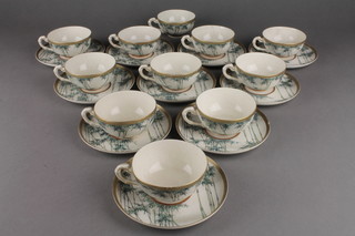 An early 20th Century Japanese Satsuma teaset comprising 10 tea cups and saucers with bamboo decoration