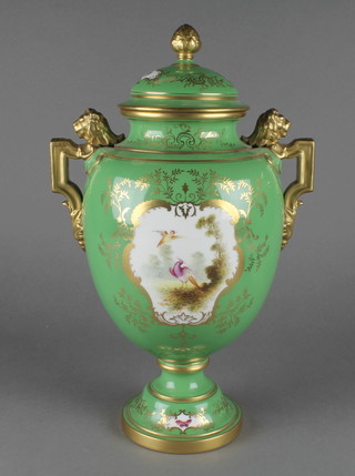 A Coalport green ground 2 handled vase and cover with a panel of exotic birds opposed by a panel of spring flowers with lion handles 14" 