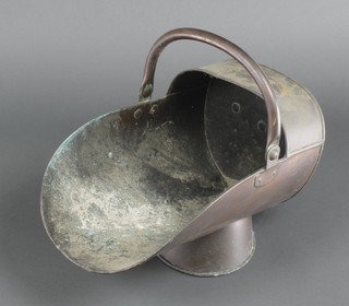A 19th Century copper helmet shaped coal scuttle