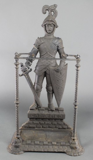 A Victorian cast iron stick/umbrella stand in the form of a standing knight 24"h x 15"w x 8"d 