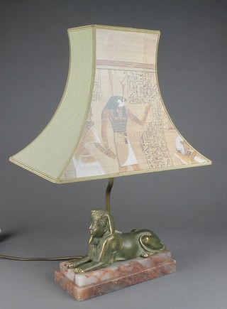 A table lamp in the form of a sphynx raised on a stepped marble base 7" 