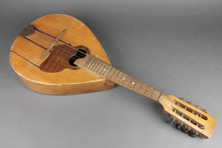 An 8 stringed mandolin, labelled Fabryka Insumentow Lutniczych Lubin Legnicki 1954 