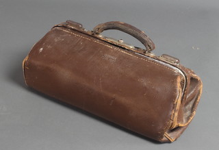 A brown leather Gladstone bag marked Pic 1964 7"h x 19"w x 7"d 