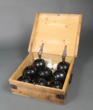 Harrods, a club lawn bowls set comprising 8 bowling woods marked Harrods and 2 jacques, contained in a pine box with hinged lid 