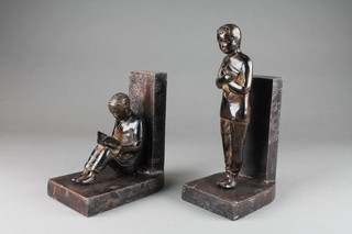 A pair of Chinese metal bookends in the form of standing boy and seated boy 7" 