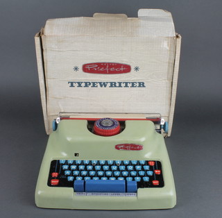 A Mettoy Perfect typewriter no.4320 with original cardboard case 