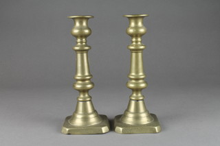 A pair of 19th Century brass candlesticks with ejectors 9" 