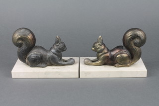 A pair of Art Deco spelter and marble bookends in the form of squirrels with nuts 6 1/2" 