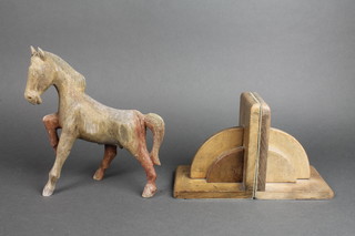 A pair of Art Deco oak book ends and a carved wooden figure of a horse 
