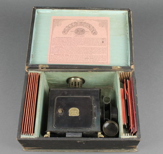 A 19th Century childs German EP magic lantern complete with burner, lens and glass chimney and 22 various slides (3 slides f)