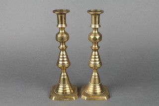 A pair of 19th Century brass candlesticks with knopped stems 10" 