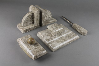 An Art Deco marble desk set comprising letter opener, blotter, ink well and a pair of book ends 